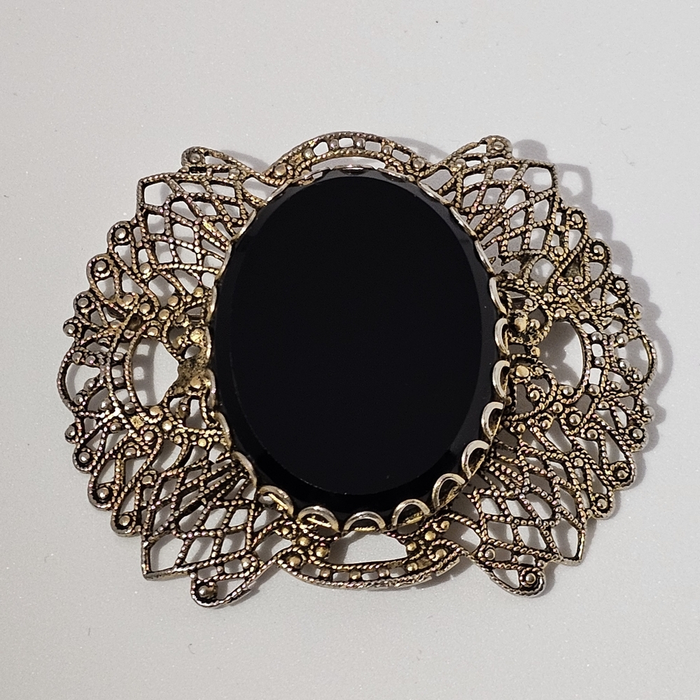 Elegant Black and Gold Brooch